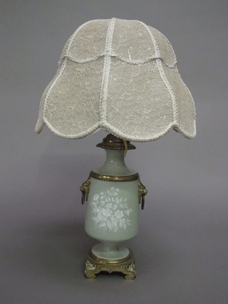 A Continental green porcelain oil lamp with gilt metal mounts, converted to a table lamp, cracked