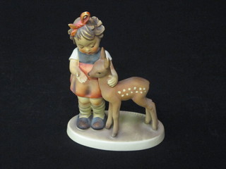 A Goebel figure of a standing girl with deer, base impressed  1947 5"