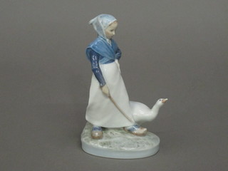 A Royal Copenhagen figure of a lady with a goose, base marked  067 7"