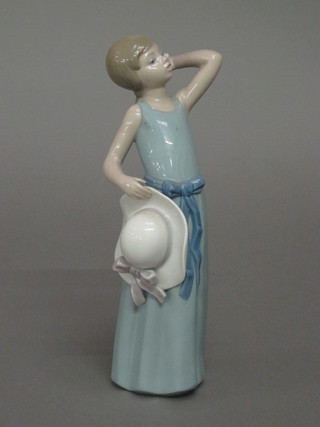 A Lladro figure of a girl in a blue dress 9"