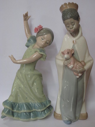 A Lladro figure of a Spanish girl dancer 7" and a Lladro figure group of a standing boy with wise man/King 8", head f and r,