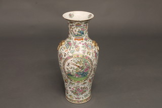 A large 19th Century Canton famille rose porcelain vase of club form 24", heavily f and r,  ILLUSTRATED