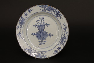 An Oriental blue and white plate with floral decoration 9", some chips to rim