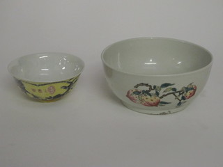 An Oriental yellow glazed bowl with floral decoration, the base with 4 character mark 4" and 1 other decorated fruit, the base  with seal mark 7"