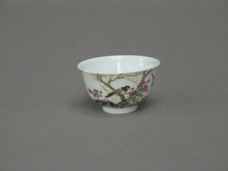 An Oriental tea bowl decorated birds amidst branches, base with  6 character mark 2"
