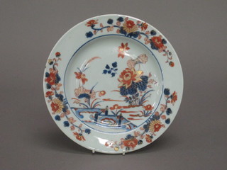 A Kanghsi circular plate with floral decoration 9"