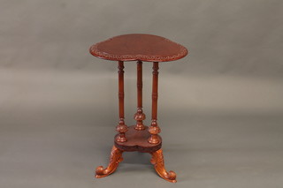 A Victorian style carved mahogany 2 tier triform table, raised on  3 square supports 20"