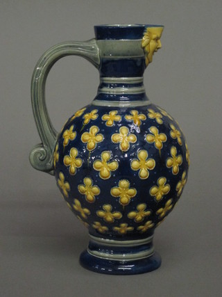 A Mintons Majolica blue jug with floral decoration, base marked 696 11"