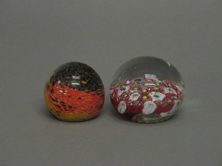 2 circular glass paperweights, a Murano glass paperweight and 1 other