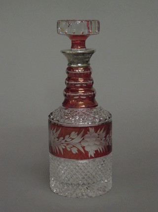 An etched and cut glass mallet shaped decanter and stopper with  silver rim
