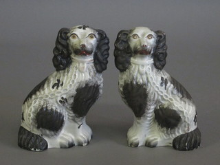 A pair of Staffordshire figures of seated Spaniels 7"