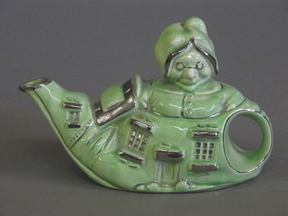 A Lingard green glazed pottery teapot in the form of The Old  Woman Who Lived in a Shoe