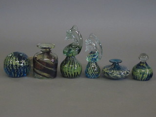 2 Mdina glass paperweights in the form of sea horses 7" and 5", a square Mdina glass vase 4", 2 Mdina glass paperweights and a  squat shaped vase 2"