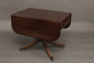 A 19th Century mahogany pedestal Pembroke table fitted 2 long  drawers, raised on a ring turned column with tripod supports  ending in brass caps and castors 35"  ILLUSTRATED