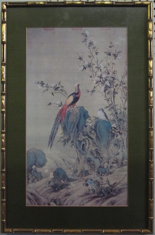 An Oriental coloured print of Pheasants contained in a bamboo gilt finished frame 17" x 10"