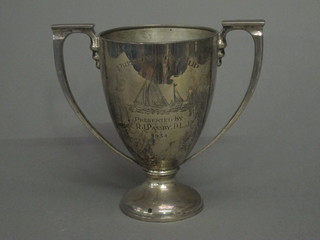 A silver twin handled trophy cup, London 1934 13 1/2 ozs   ILLUSTRATED