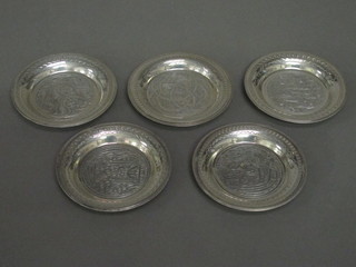 7 circular Eastern white metal dishes 3 1/2"