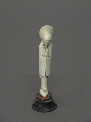 A carved ivory figure of a standing Deity 4"