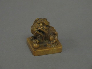 An Oriental carved hardstone seal in the form of a seated Dog of Fo 2"