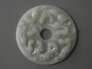 A circular carved Oriental "jade" panel depicting dragons 5"  ILLUSTRATED