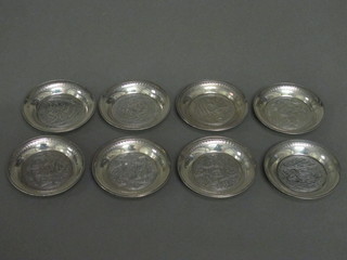 8 various Eastern white metal circular engraved dishes 3"