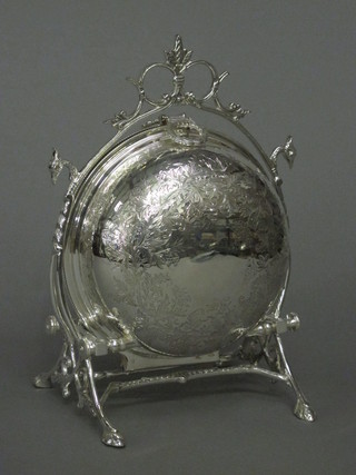 An engraved circular silver plated twin section muffin dish