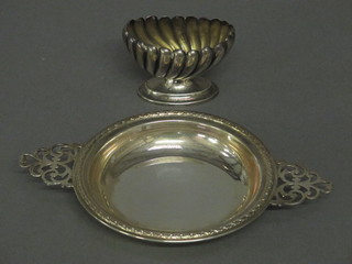 A circular silver twin handled dish and a silver salt 3 ozs