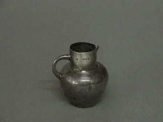 A Victorian silver cream jug, London 1890, 2 ozs