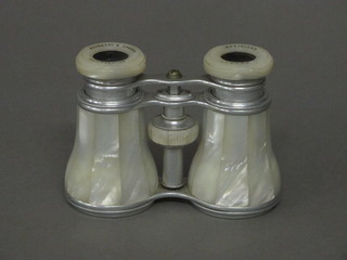 A pair of chrome and mother of pearl opera glasses by Negretti  & Zambra