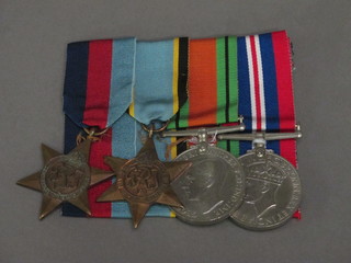 A group of 4 medals comprising 1939-45 Star, FACSIMILE Air  Crew Europe Star, Defence and War medal