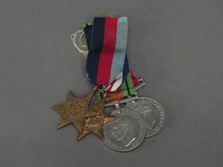 A group of 4 medals comprising 1939-45 Star, Burma Star,  Defence and War medal