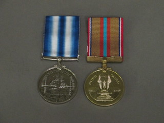 A Canal Zone medal together with an Atlantic Zone medal
