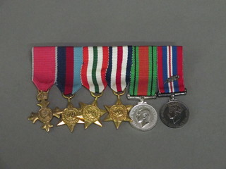 A group of 6 miniature medals comprising OBE Civil Division  1939-45 Star, Italy Star, France and Germany Star, Defence and  War medal