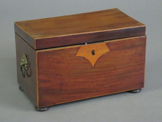 A rectangular Georgian mahogany twin compartment tea caddy with hinged lid, raised on bun feet 8"