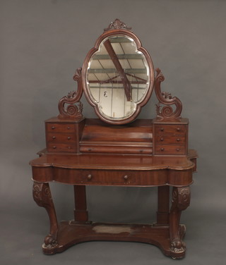 A Victorian mahogany Duchess dressing table fitted an oval  bevelled plate mirror, the base fitted 6 short and 1 long drawers,  raised on cabriole supports 46 1/2"