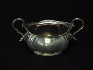 An oval silver plated twin handled sugar bowl