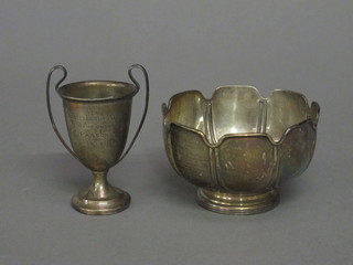 A Victorian circular silver pedestal bowl with wavy border, London 1871 and a silver twin handled trophy cup 7 ozs