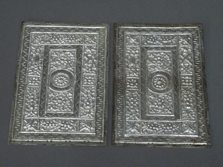 A pair of Malaysian embossed white metal cushion plates 5 1/2"  x 3 1/2"  ILLUSTRATED