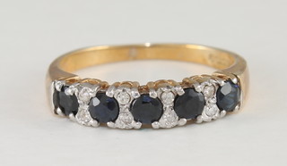 A lady's yellow gold half eternity ring set sapphires and  diamonds