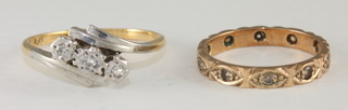 A lady's 9ct gold dress ring with 3 illusion set diamonds and a  9ct gold eternity ring