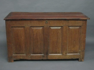 An 18th Century oak coffer of panel construction with hinged lid  49"
