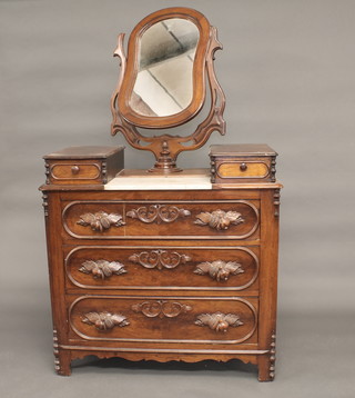 A Continental carved mahogany dressing chest with shaped plate mirror, the top with marble inset and 2 glove drawers above 3  long drawers, 40"  ILLUSTRATED