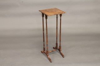 A square Victorian rosewood occasional table, raised on turned supports with H framed stretcher, 11"