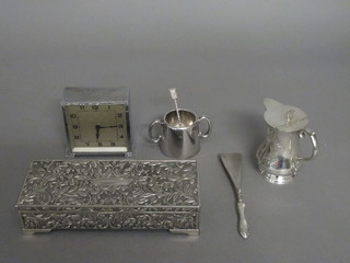 An engraved silver plated hotwater jug 4", a silver plated trinket box, a chrome plated mantel clock etc