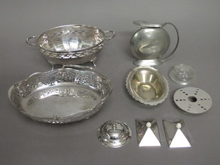 An oval pierced silver plated twin handle dish raised on hoof feet  9", an oval cake basket with swing handle and a small collection  of plated items