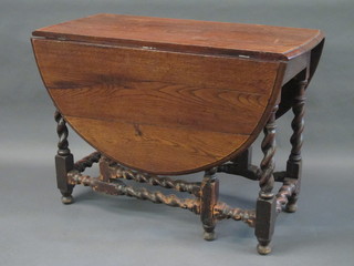 An 17th/18th Century oak oval drop flap gateleg dining table  raised on spiral turned supports 42"