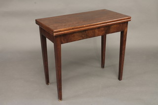A rectangular Georgian mahogany card table with red leather insert, raised on square tapering supports 33"