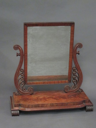 A William IV rectangular plate dressing table mirror contained in  a mahogany swing frame 27"