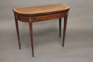 A Georgian mahogany D shaped card table with crossbanded top,  raised on square tapering supports 36"