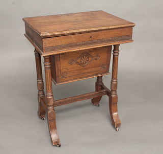 A Victorian rectangular oak sewing box with hinged lid, the base fitted a deep basket raised on turned supports with H framed  stretcher 22"